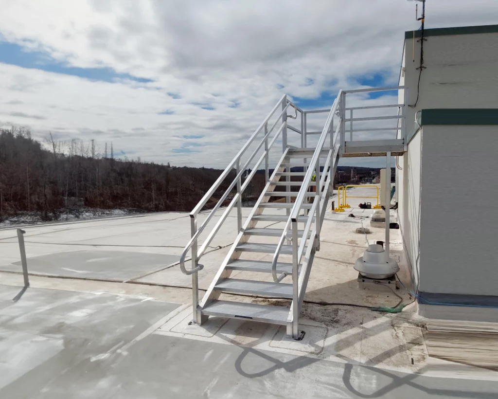 Non-penetrating commercial building rooftop stair installation
