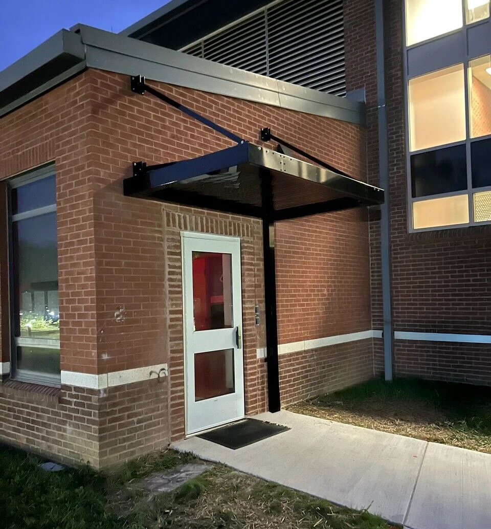 black cantilever awning school Installation