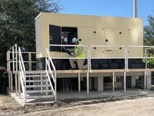worker with PPE accessing power generator
